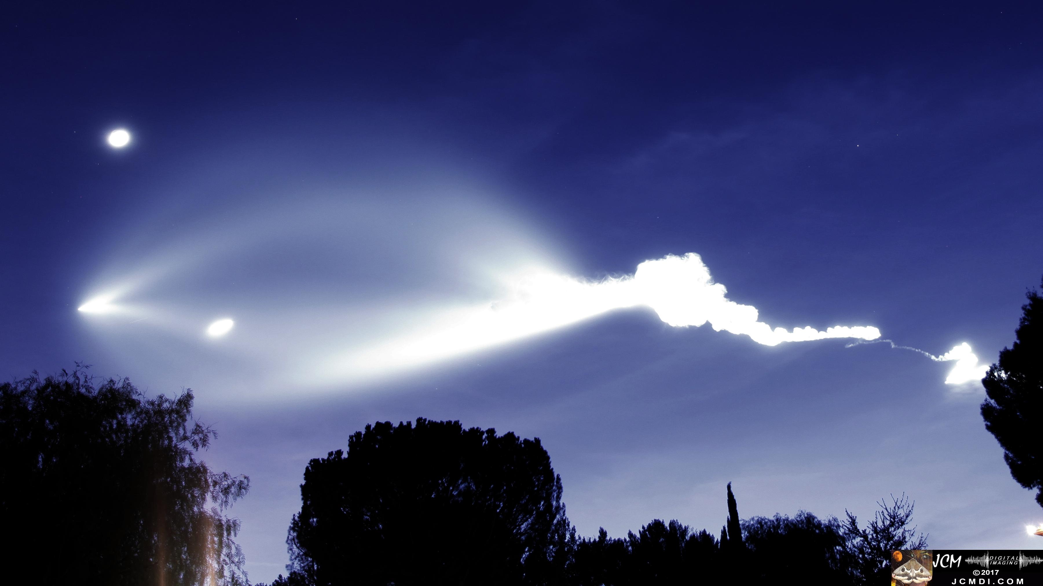 Spacex Falcon 9 dusk launch plume and moon with detached first stage visible